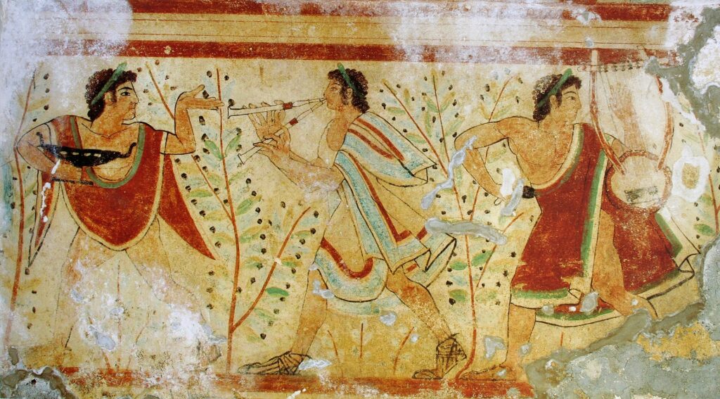 Fresque étrusque montrant des danseurs en mouvement, accompagnés de musiciens jouant de l'aulos et de la lyre.