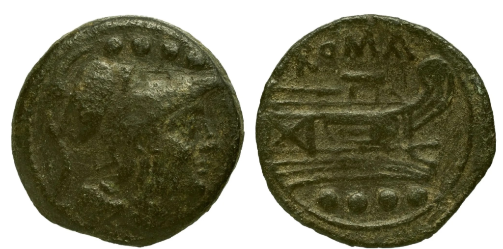Monnaie de bronze portant une tête barbue de profil.
