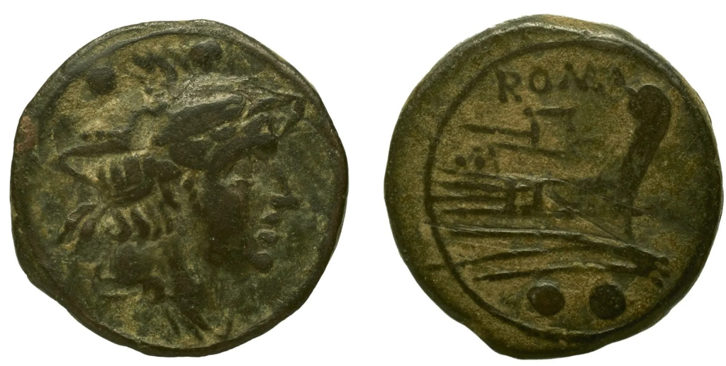 Monnaie de bronze portant une tête coiffée d'une peau de lion.