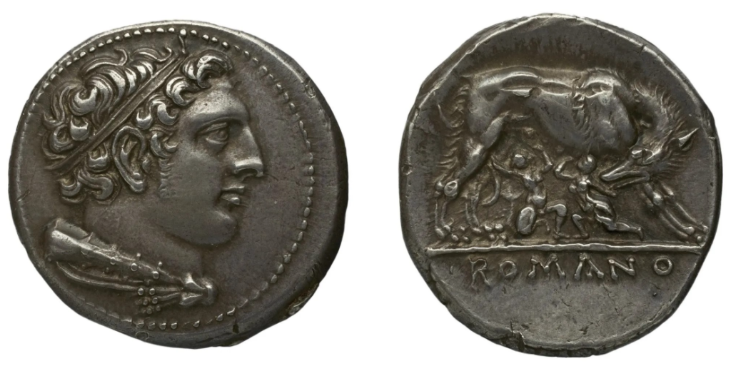 Monnaie d'argent : une tête de profil sur une face, une louve allaitant deux enfants sur l'autre.